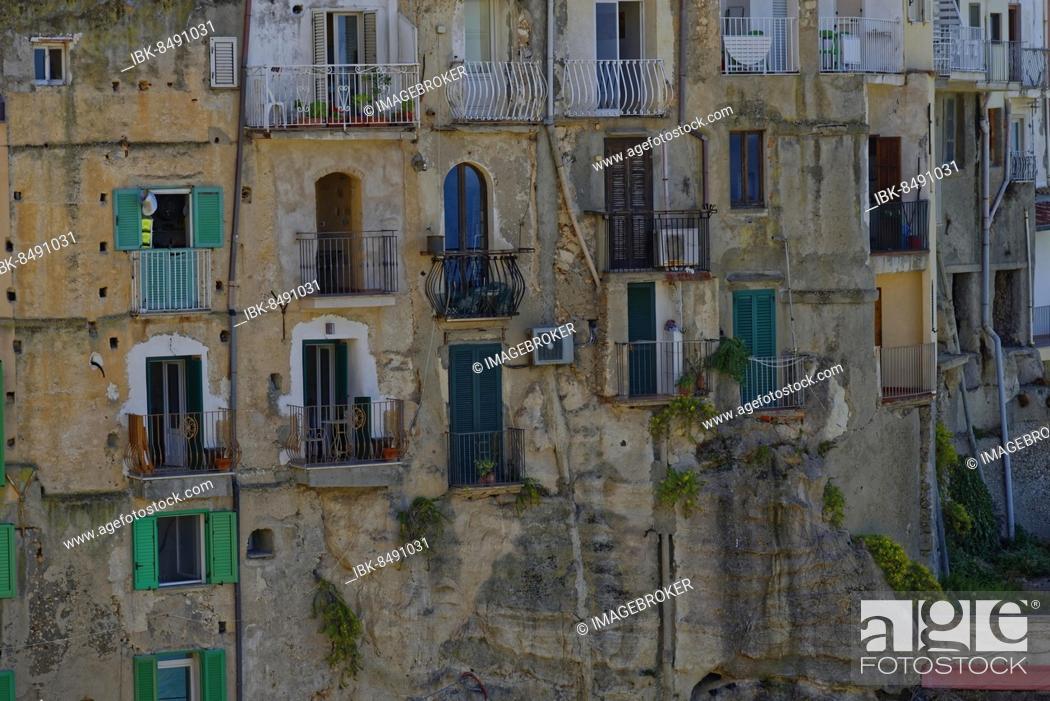 Stock Photo: Dilapidated house facade with balconies of the medieval town of Tropea built on rocks of sandstone, Tropea, Vibo Valentia, Calabria, Southern Italy, Italy.