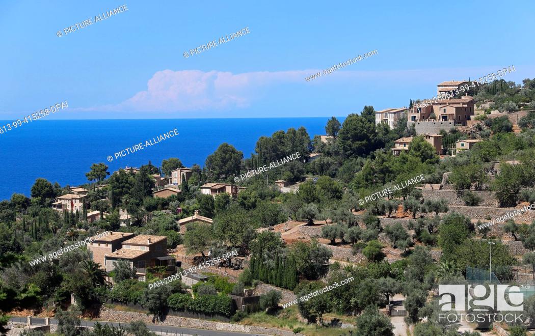 Stock Photo: 13 June 2020, Spain, Deia: View of the village with many German inhabitants or owners of second homes in Mallorca. The Balearic Islands.