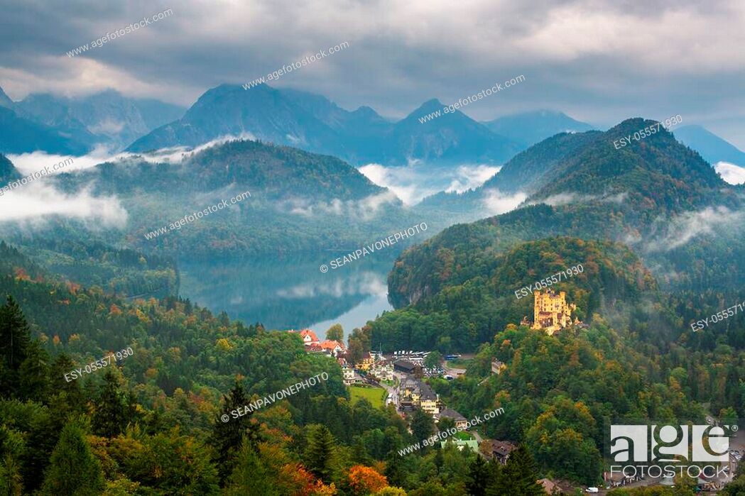 Stock Photo: Hohenschwangau, Germany landscape with the castle and Lake Alspee with a rolling fog.