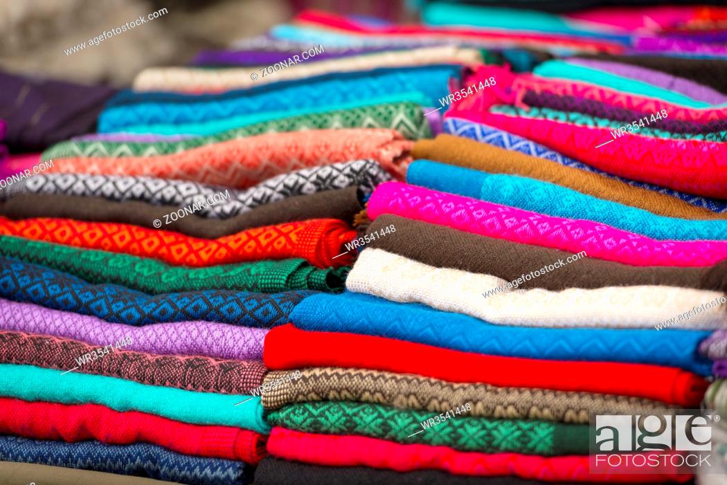 Stock Photo: Colorful stack of handcrafted material at a market in San Cristobal, Mexico.