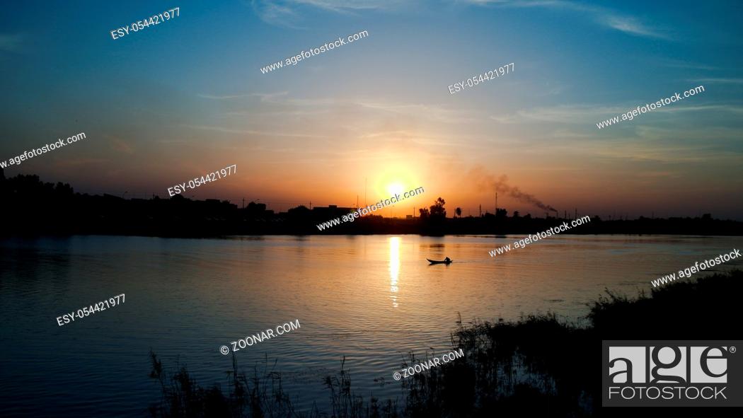 Stock Photo: Landscape of Euphrates river in Nasiriyah city at the sunset, Iraq.
