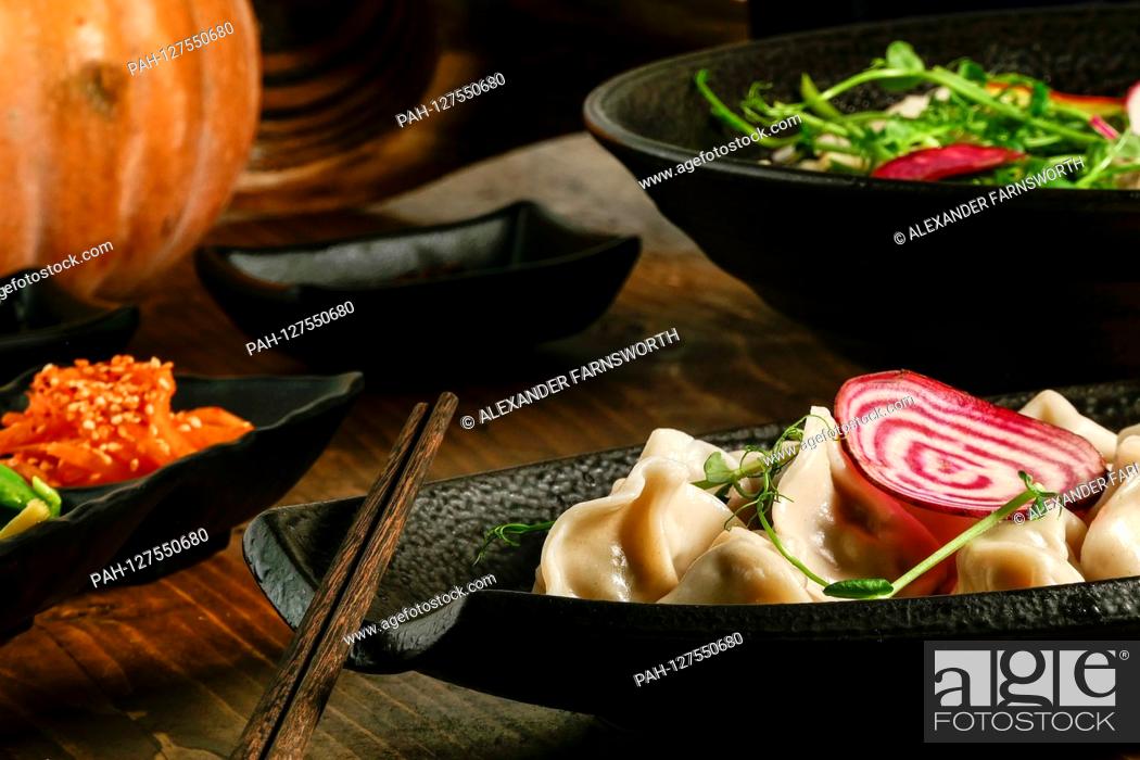 Stock Photo: A dish of dumplings at an Asian restaurant | usage worldwide. - STOCKHOLM/Sweden.