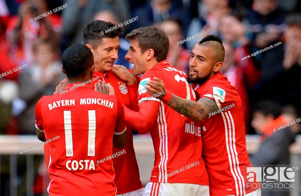 Stock Photo: Munich's Douglas Costa (L-R), goal keeper Robert Lewandowski, Thomas Mueller and Arturo Vidal celebrate the 3-0 goal during the German Bundesliga soccer match.