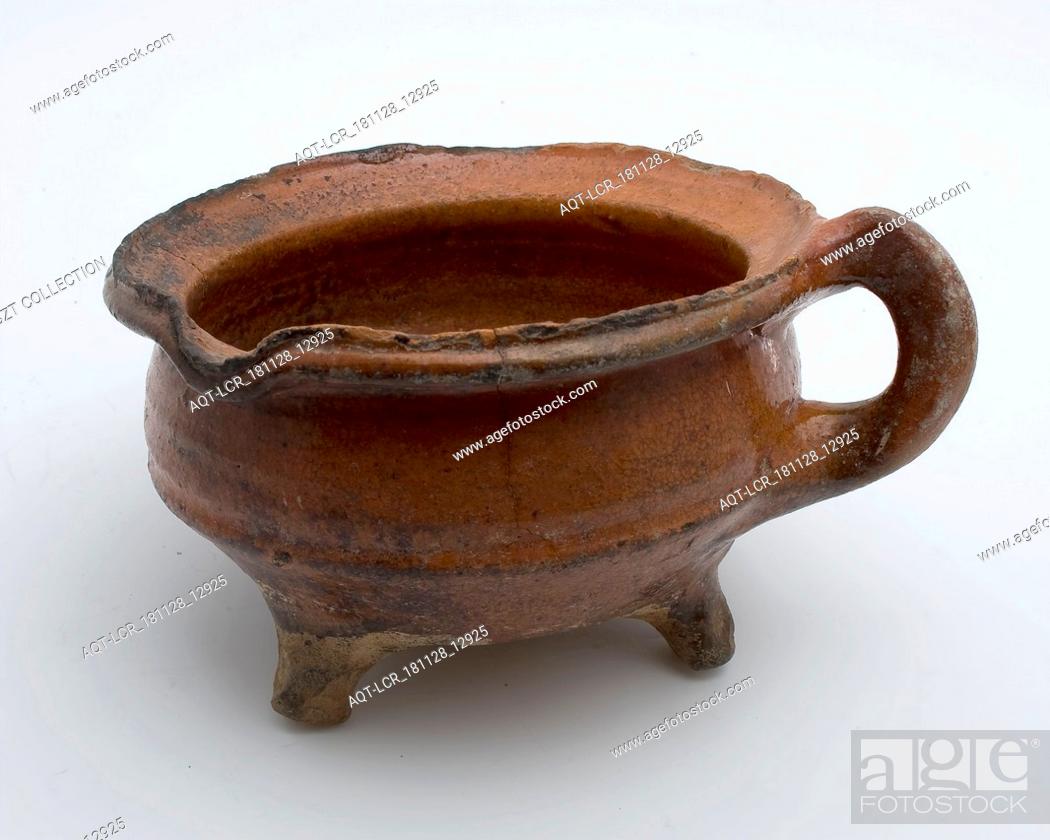 Stock Photo: Pottery cooking jug, grape-model, red shard with lead glaze, vertical band-ear, on three legs, cooking jug be found in the earthenware ceramics earthenware.