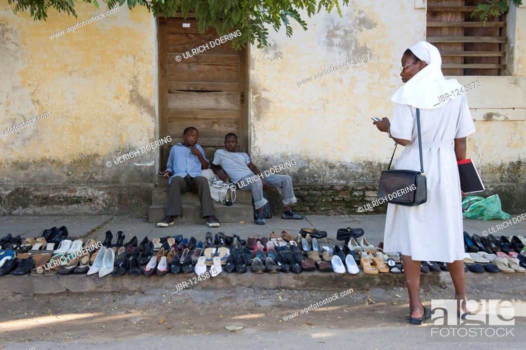 Stock Photo: Street hawkers selling shoes, Quelimane, Mozambique, Africa.