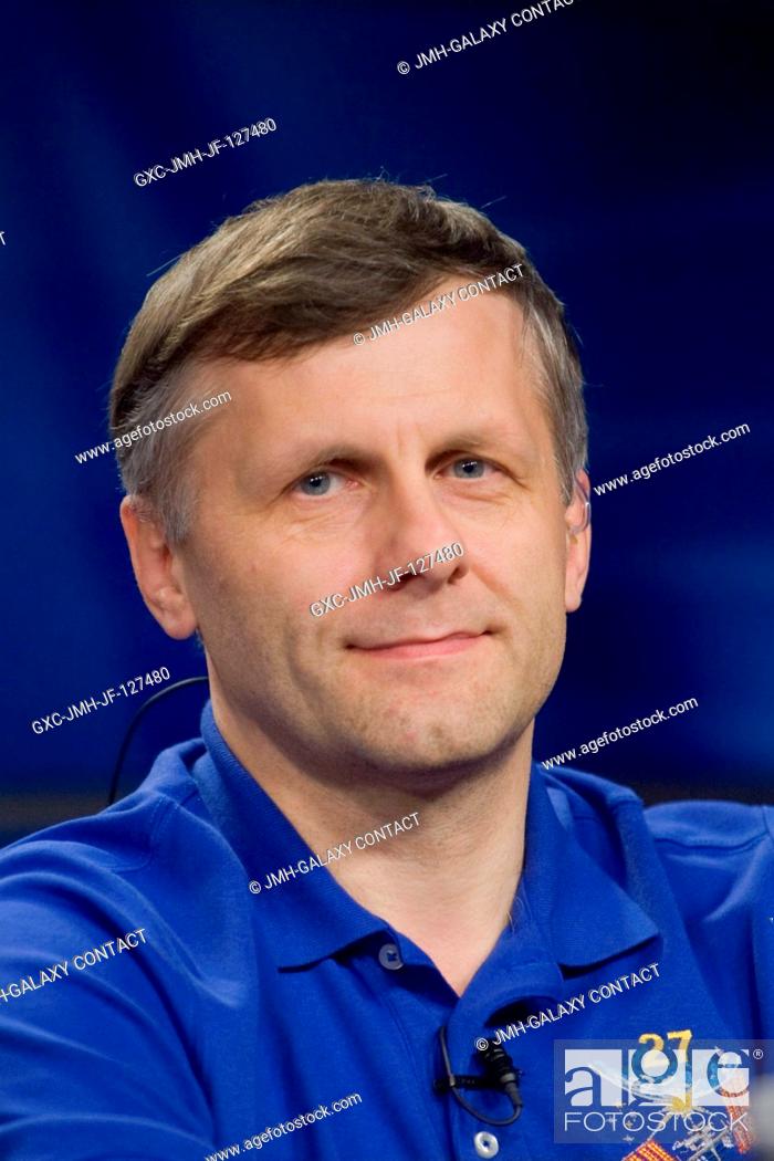 Stock Photo: Russian cosmonaut Andrey Borisenko, Expedition 27 flight engineer and Expedition 28 commander, fields a question from a reporter during an Expedition 2728.