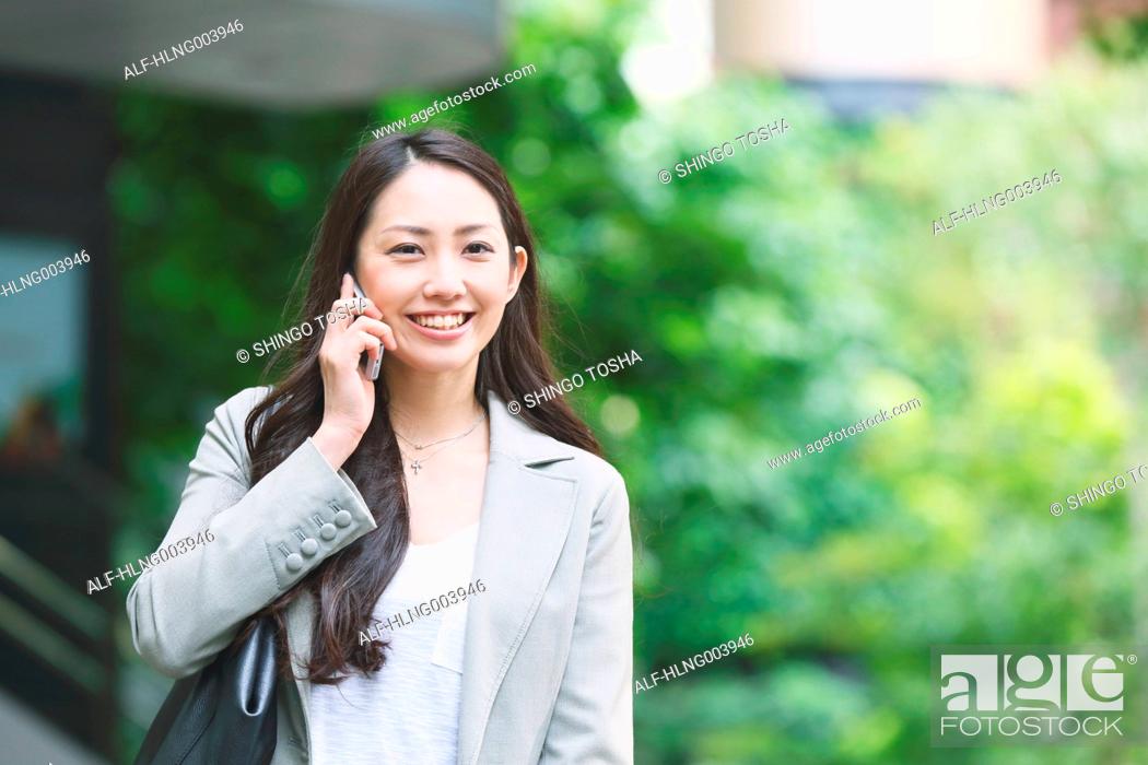 Stock Photo: Japanese attractive businesswoman in downtown Tokyo.