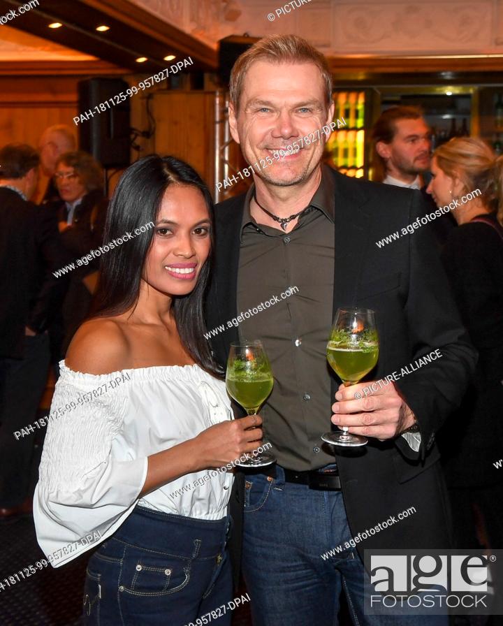 Stock Photo: 25 November 2018, Bavaria, München: Sven Unterwaldt, director and his girlfriend Aila come to the aftershow party after the film premiere of ""Tabaluga - Der.