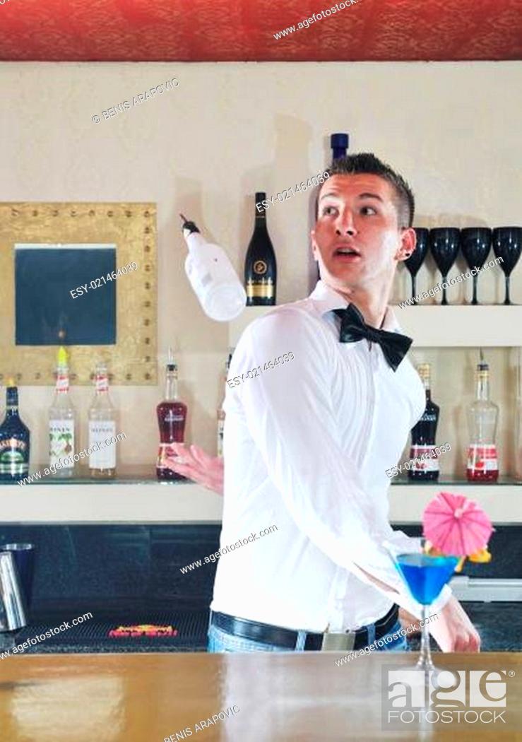 Stock Photo: pro barman prepare coctail drink on party.