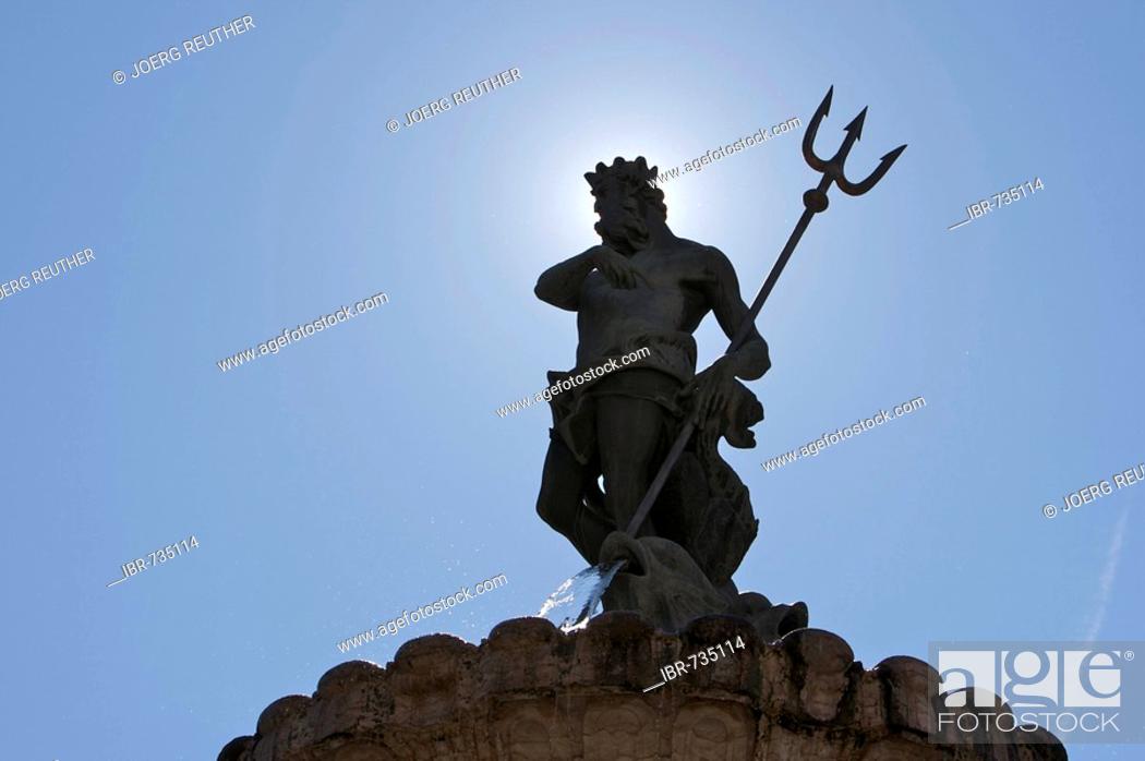 Stock Photo: Statue of Neptune, Neptune Fountain backlit on the cathedral square in Trento, Northern Italy, Europe.
