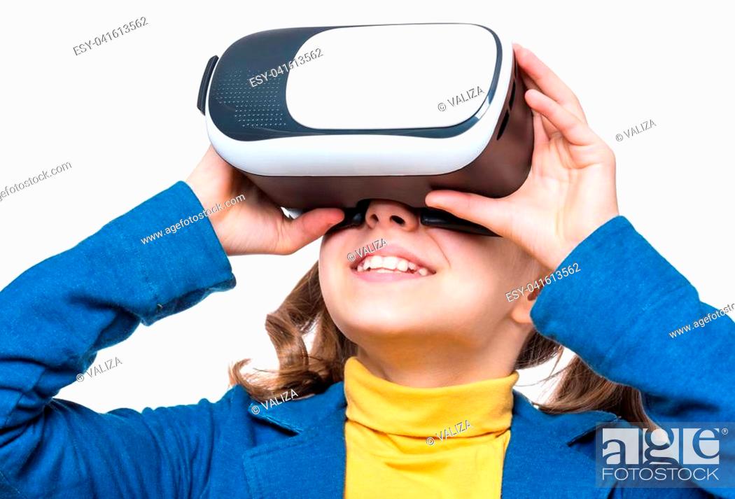 Happy little girl wearing virtual reality goggles watching movies or  playing video games, Stock Photo, Picture And Low Budget Royalty Free  Image. Pic. ESY-041613562 | agefotostock