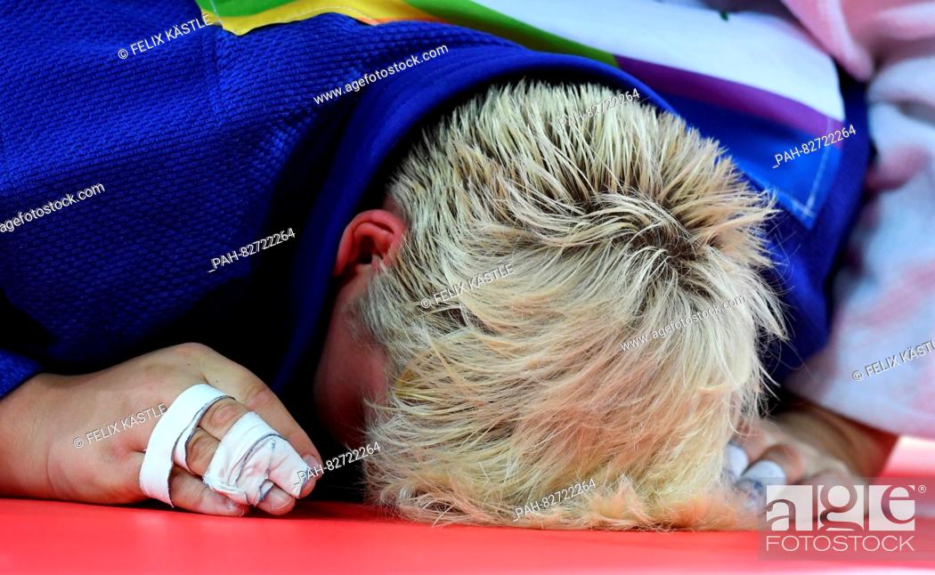 Stock Photo: Jasmin Kuelbs of Germany (blue) reacts after loosing against Ksenia Chibisova of Russia (not pictured) during the Women +78 kg Elimination Round of 32 of the.
