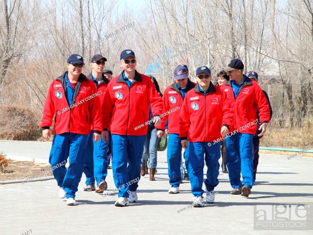 Stock Photo: Outside the Cosmonaut Hotel crew quarters in Baikonur, Kazakhstan, the prime and backup Expedition 27 crew members take time from their pre-launch preparations.
