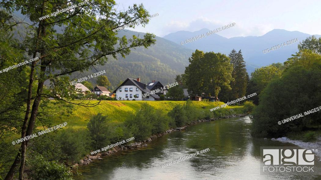 Stock Photo: near Ribcev Laz, Upper Carniola, Slovenia, Houses beside the Sava Bohinjka river.