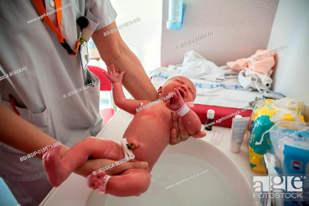 Stock Photo: Reportage on postpartum care in the maternity clinic in Chambéry, France. Newborn babies receive their first postnatal care.