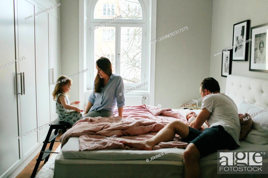 Stock Photo: Family in bed.