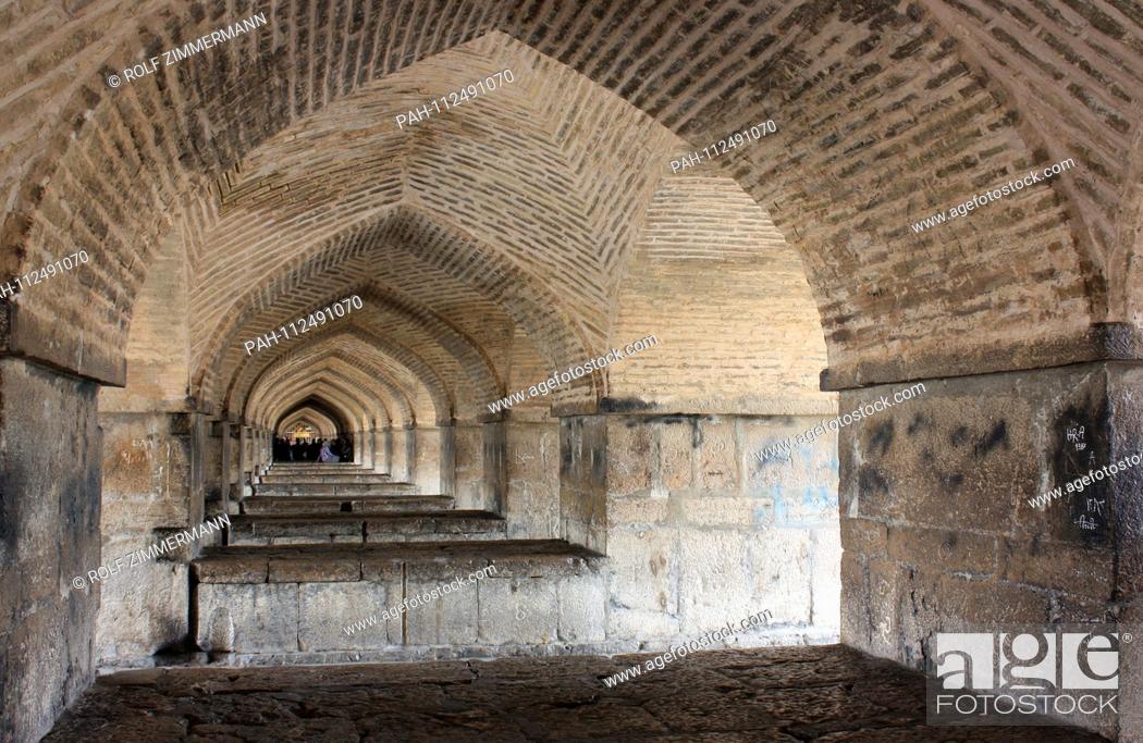 Stock Photo: Iran - Isfahan (Esfahan), capital of the province of the same name, interior view of the 33-arch bridge. The bridge is 290 meters long and was built as a.