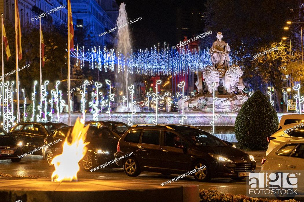 Stock Photo: Christmas decoration at the Cibeles Fountain and permanent fire flame for the victims of Covid-19, MADRID, SPAIN, EUROPE.