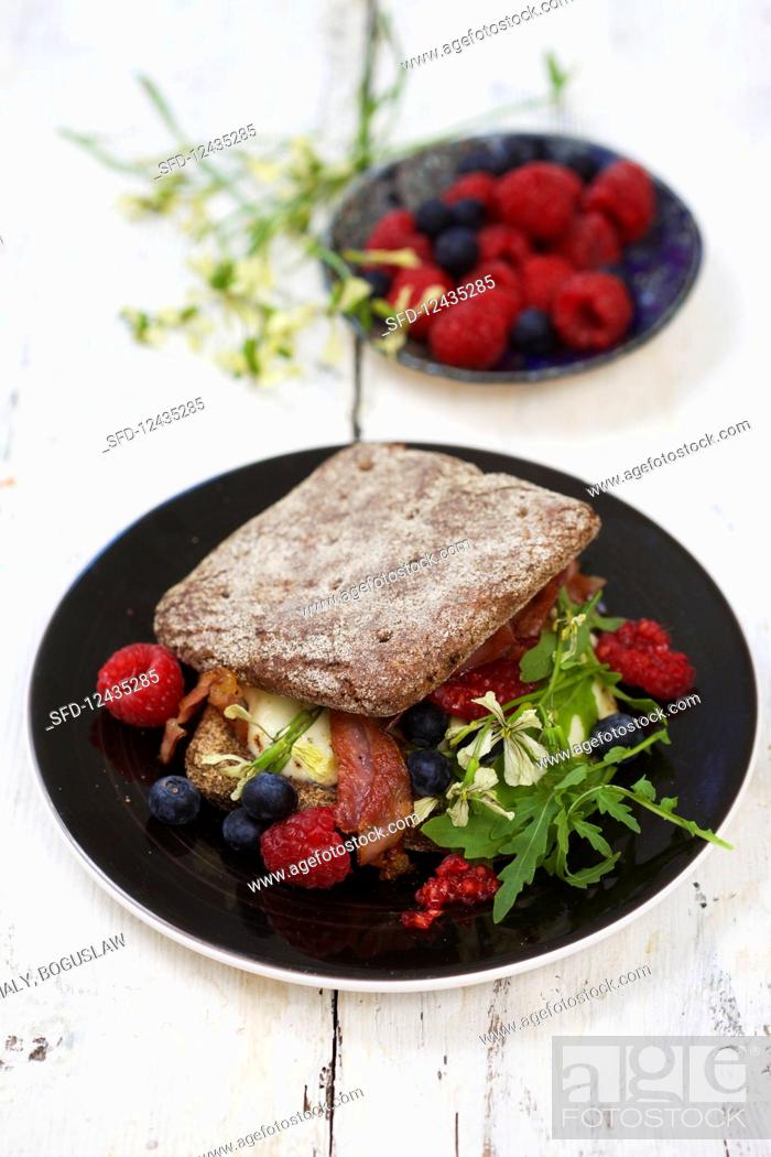 Stock Photo: Sandwich with rucola and raspberries.