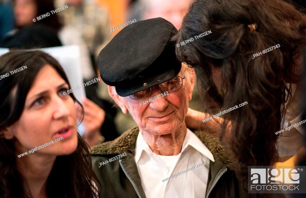 Stock Photo: Auschwitz survivor Joshua Kaufman, who travelled to Detmold from the USA, sits between his daughters Rachel (L) and Alexandra in the courtroom on another day of.