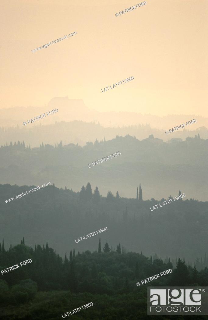 Stock Photo: Mist is small droplets suspended in the air. It can occur naturally, or artifically. Mist is rare in Corfu but can be seen early in the morning.