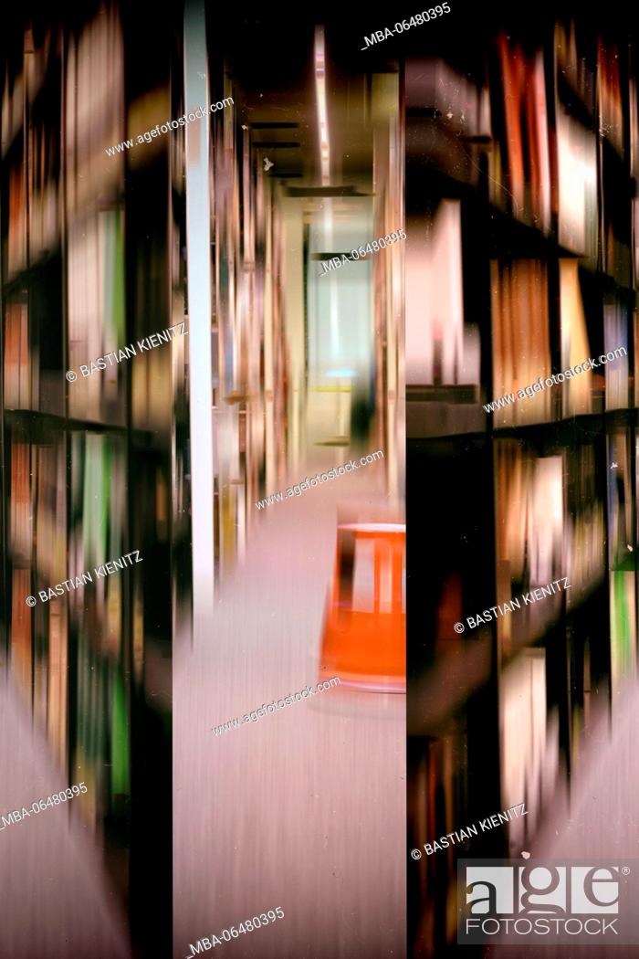 Stock Photo: Rows of books in the library of a school, blur.