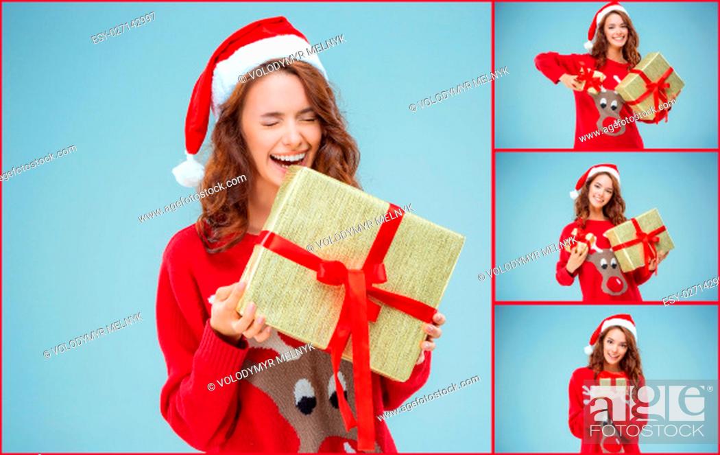 Stock Photo: Girl dressed in santa hat with a Christmas gifts. She looking at camera. Holiday concept with blue background. Collage.