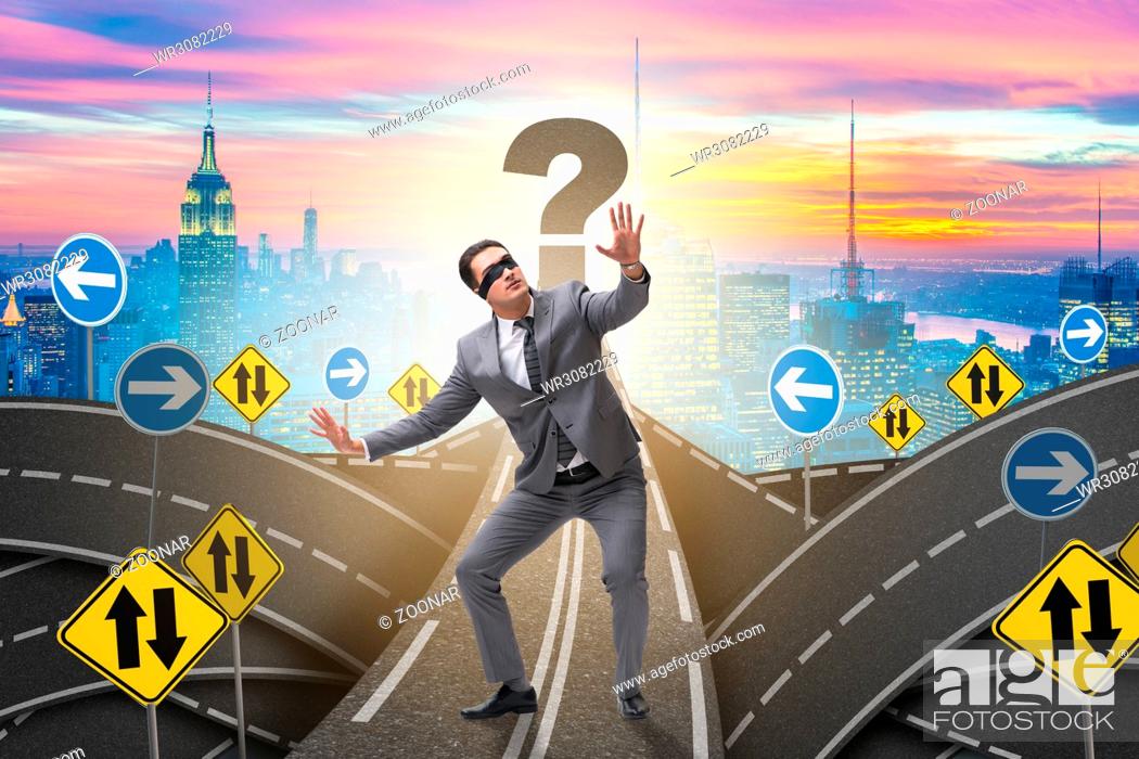 Stock Photo: Blindfold businessman on the road unsure.
