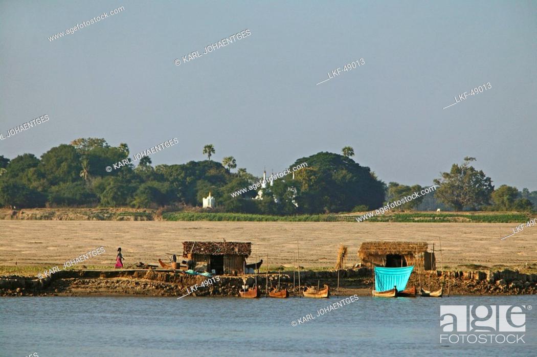 Stock Photo: Riverside huts, Irrawaddy river scene, Myanmar.