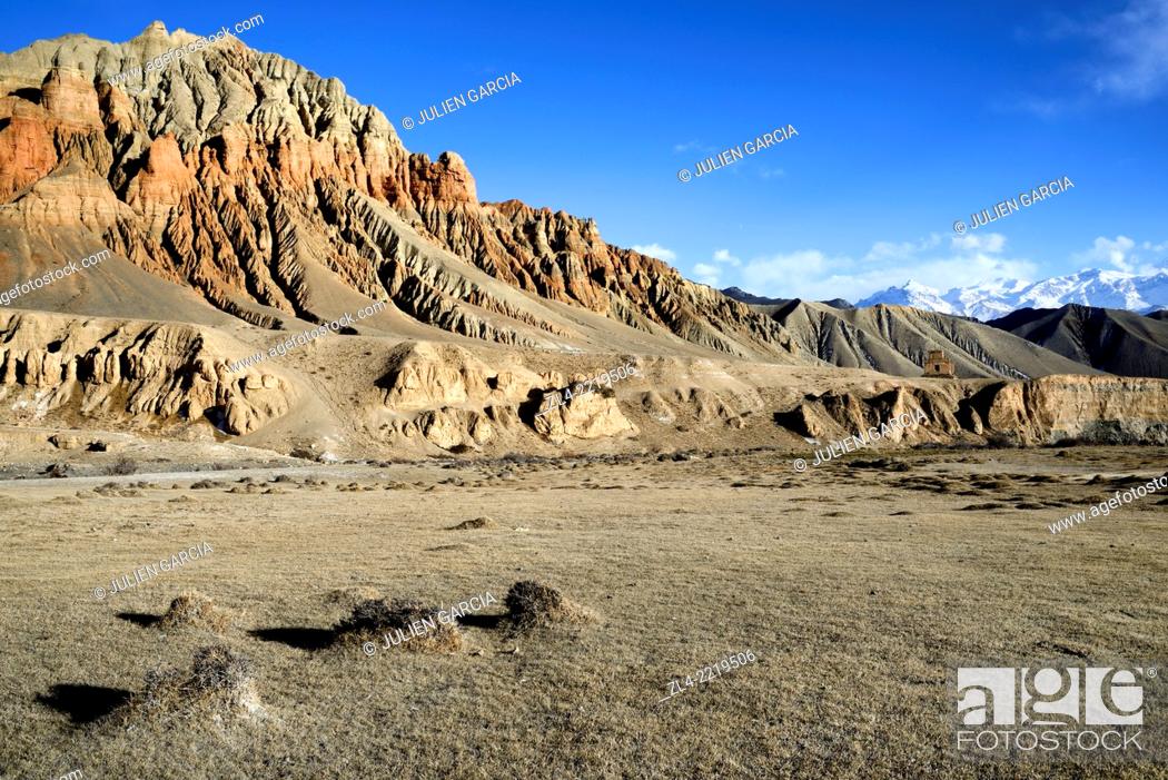 Stock Photo: Red and ochre rock formations in a valley near Dhakmar village. Nepal, Gandaki, Upper Mustang (near the border with Tibet).