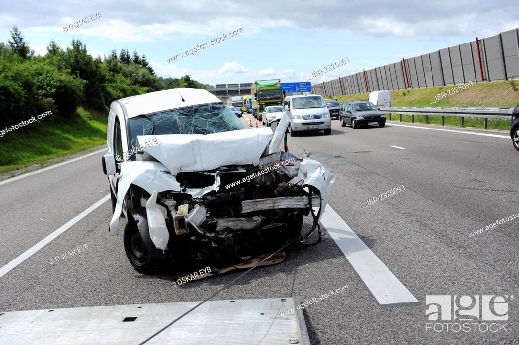 Stock Photo: A heavily damaged van is recovered after an accident on the A8 road near Leonberg by a tow truck, Baden-Wuerttemberg, Germany, Europe.