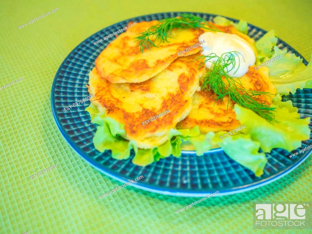 Stock Photo: potato pankakes with cream frache and dill - draniki.