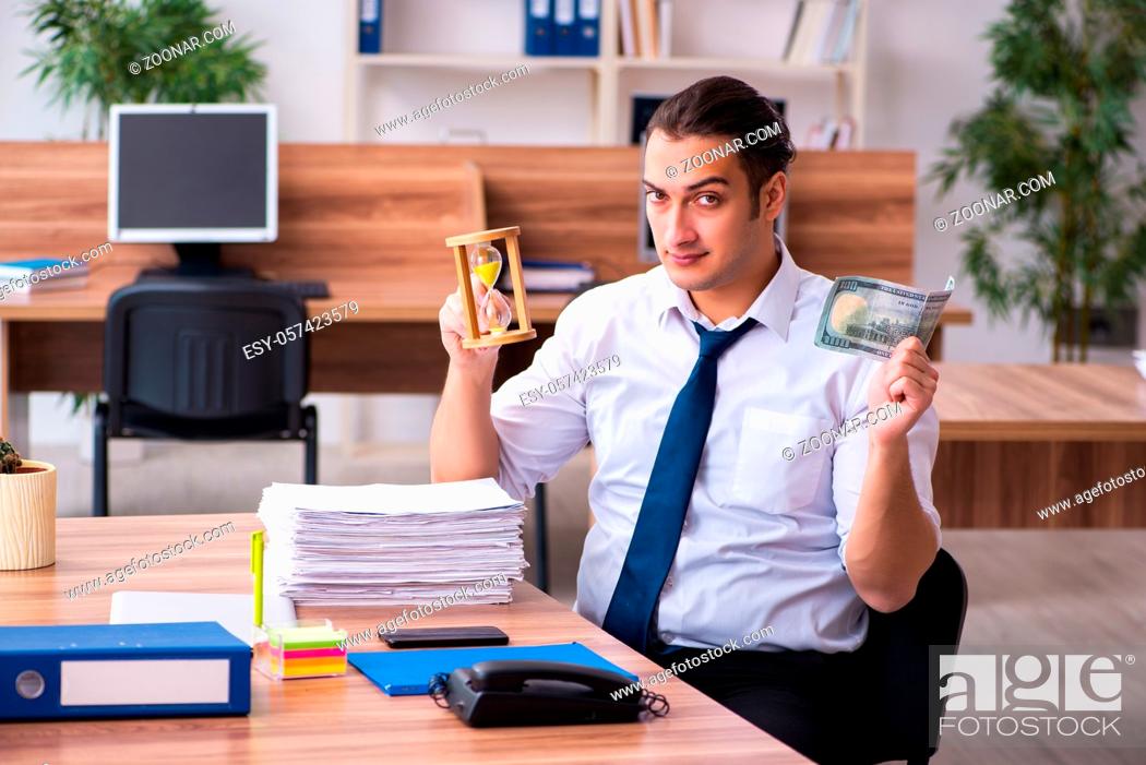 Stock Photo: Young employee working in the office.