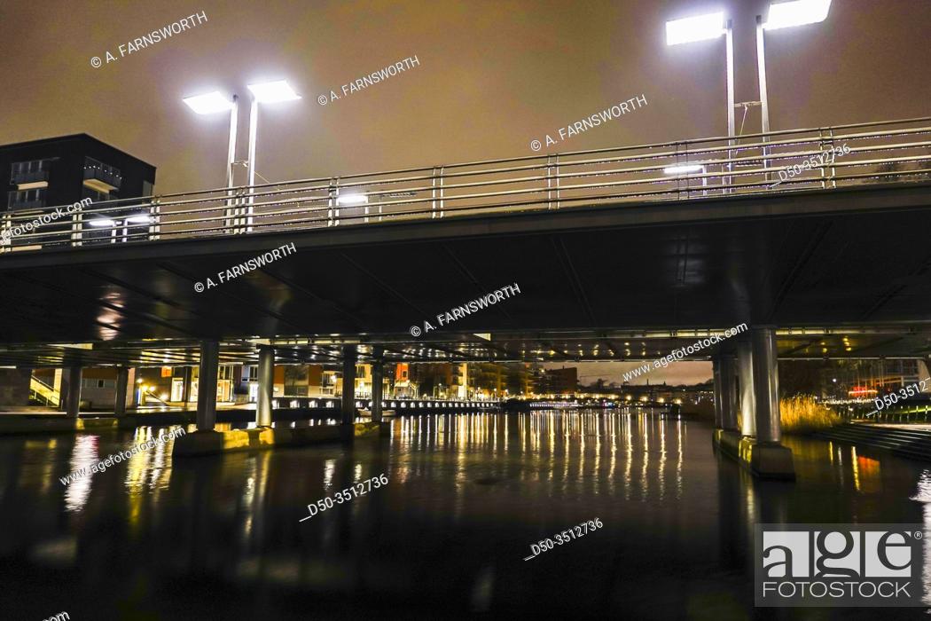 Stock Photo: STOCKHOLM, SWEDEN A bridge on Sickla Canal at night in Hammarby Sjostad.