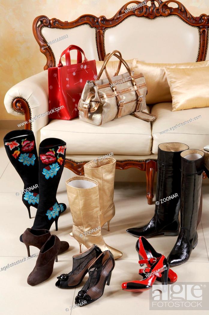 Stock Photo: Female shoes, boots and handbags.