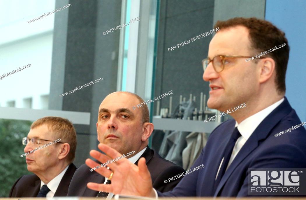 Stock Photo: 23 April 2021, Berlin: Klaus Cichutek (l-r), President of the Paul Ehrlich Institute, Lars Schaade, RKI Vice President, and Jens Spahn (CDU).