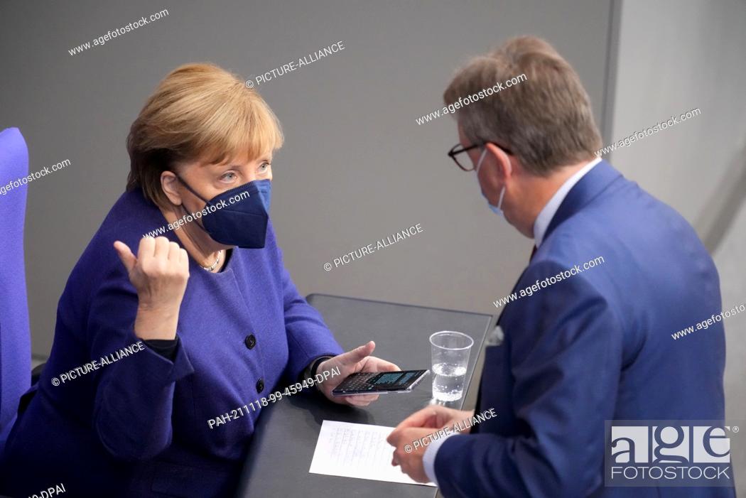Stock Photo: 18 November 2021, Berlin: Federal Chancellor Angela Merkel (CDU) and Michael Grosse-Brömer (CDU), Parliamentary Secretary of the CDU/CSU parliamentary group in.