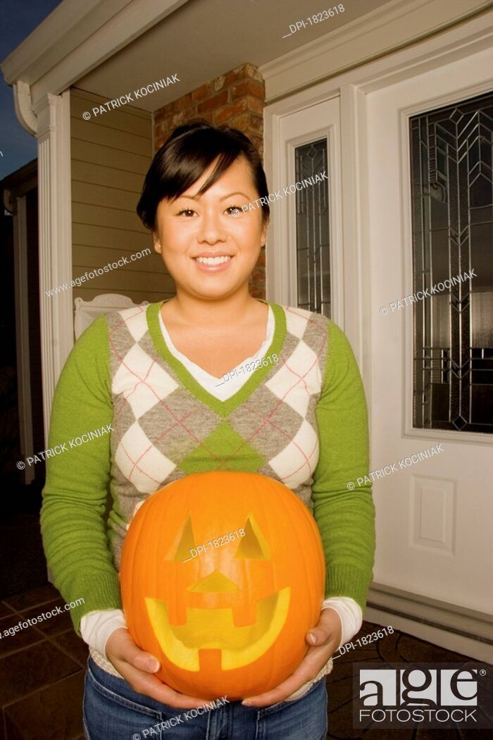 Stock Photo: Girl with pumpkin.