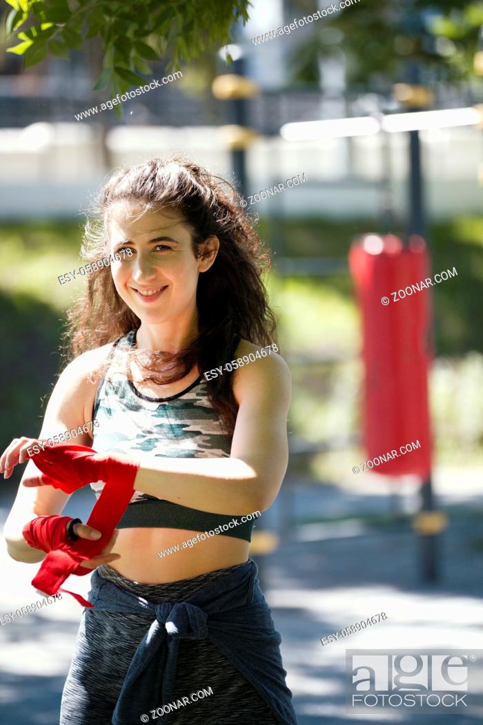 Stock Photo: Portrait of young woman - box spotsman in summer park during work out training, close up.