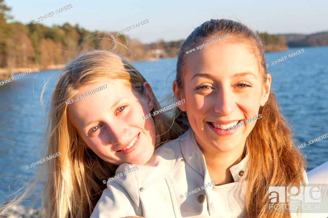 Stock Photo: Portrait of smiling sisters.