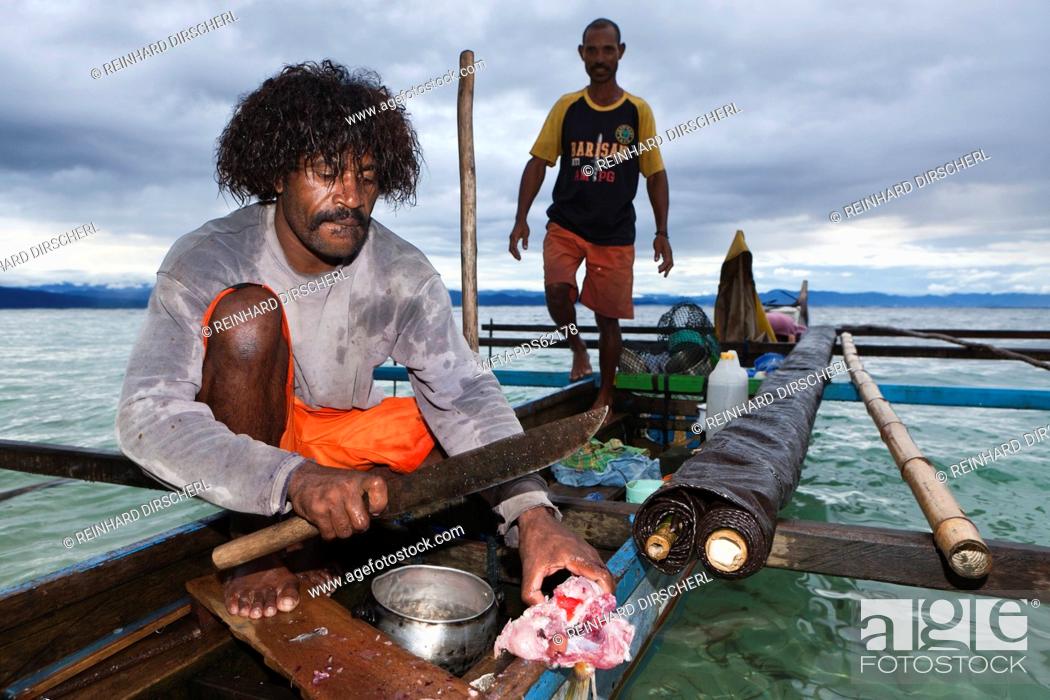 Stock Photo: Fisherman on Outrigger Boat, Cenderawasih Bay, West Papua, Indonesia.