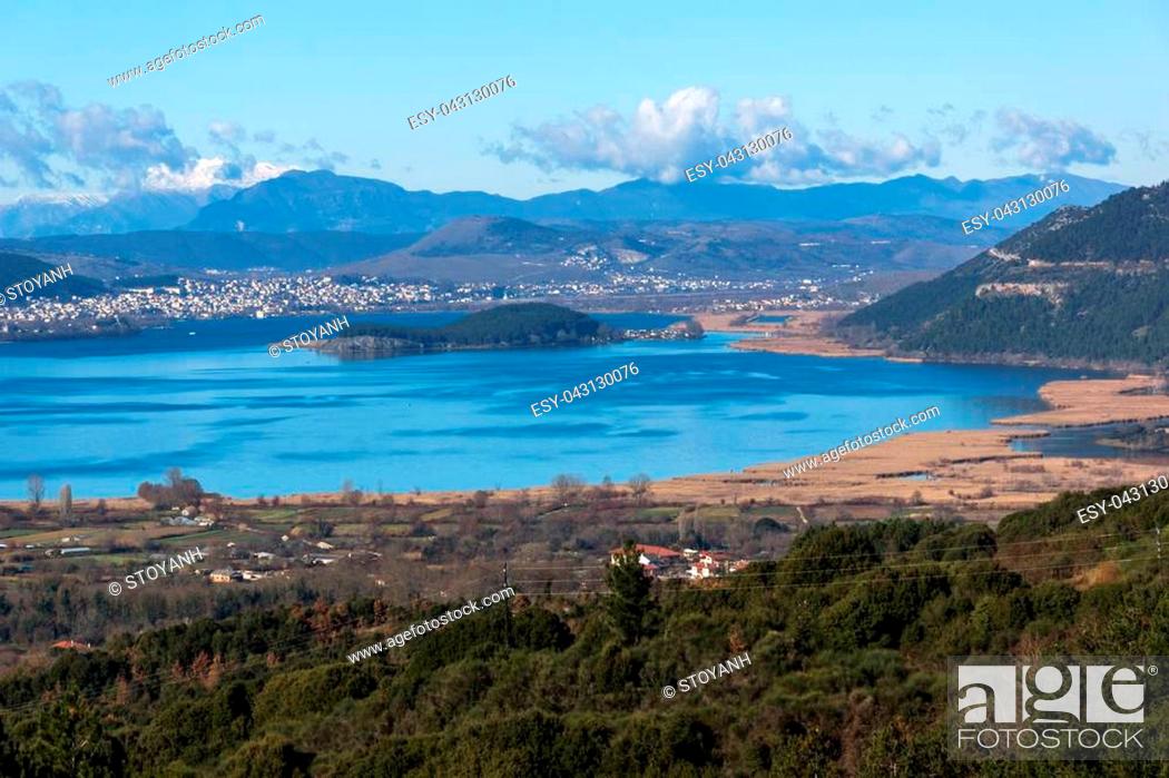 Stock Photo: Panoramic Landscape of Lake Pamvotida, Pindus mountain and city of Ioannina, Epirus, Greece.