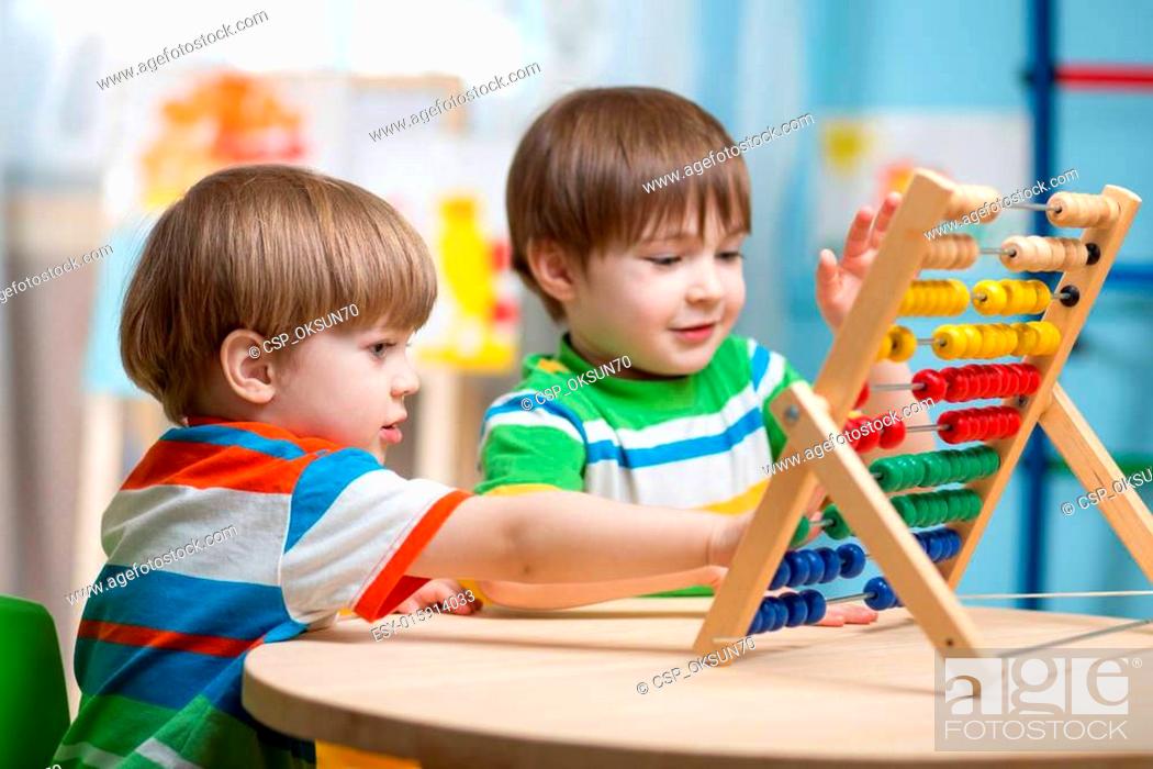 Stock Photo: children playing with abacus.