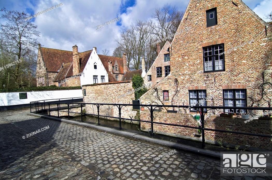 Stock Photo: A small street in Bruges, a popular tourist destination in Belgium.