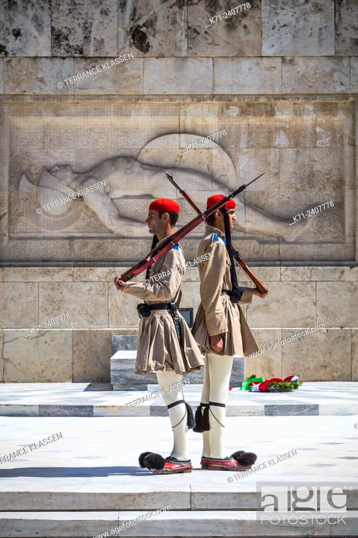 Stock Photo: Evzones, an elite Greek army unit guards the Tomb of the Unknown Soldier at the Greek National Parliament near syntagma Square, Athens, Greece.