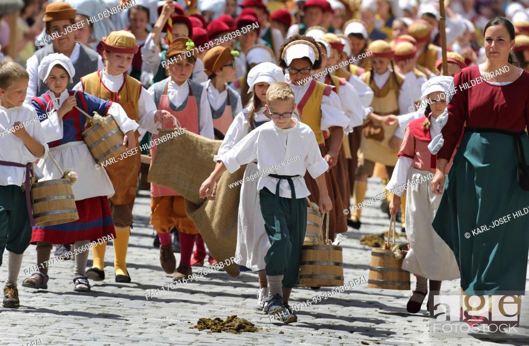 Stock Photo: Young participants of the ""Taenzelfest"" festival can be seen during its parade in Kaufbeuren, Germany, 15 July 2017. The ""Taenzelfest"" is considered as one.