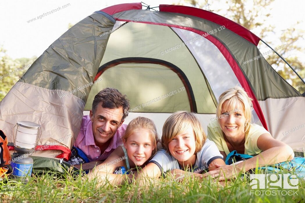 Stock Photo: Middle Aged Family On Camping Holiday In Countryside.