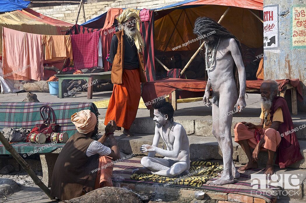 Stock Photo: naga baba, in his camp on the ghats of benares, awaiting the shivaratri closing the kumbh mela of allahabad, up, india.