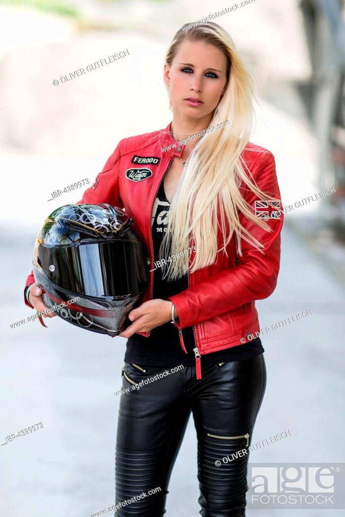 Young woman with long blonde long hair poses posing with motorcycle helmet,  Stock Photo, Picture And Rights Managed Image. Pic. IBR-4389973 |  agefotostock