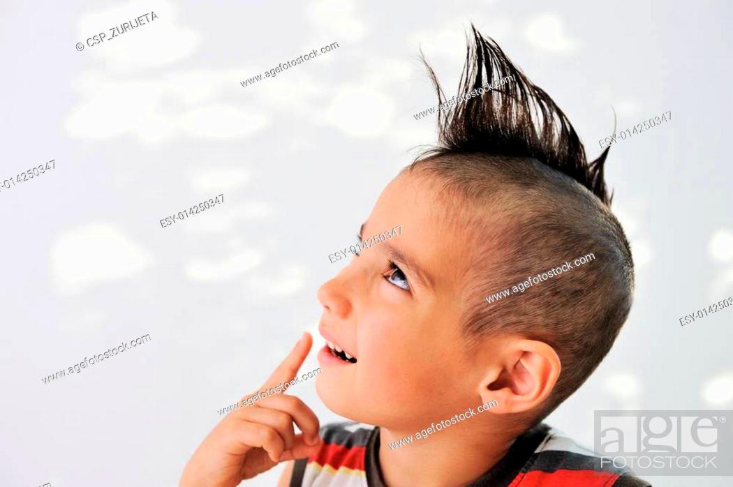 Cute little boy with funny hair and cheerful grimace, Stock Photo, Picture  And Low Budget Royalty Free Image. Pic. ESY-014250347 | agefotostock